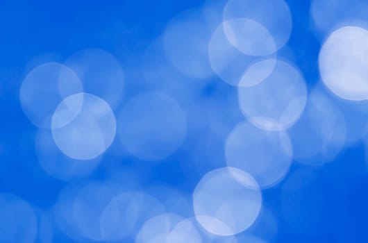 Light abstract dark bokeh christmas circle color glitter blurred black background