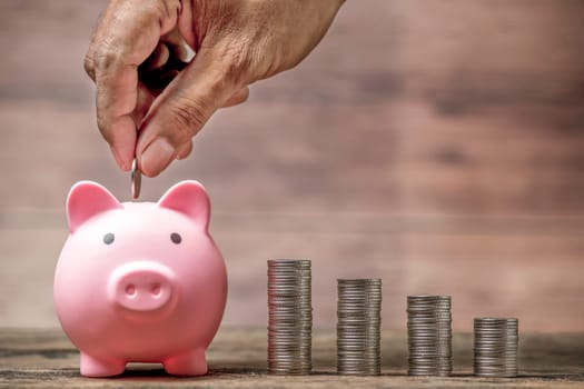 Save money and account banking for finance concept, Piggy bank with coin on blurred background, Save Monney for Investors Using Internet to Trade Stocks or Trade Fund