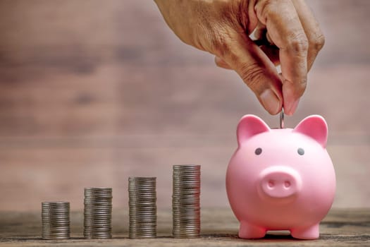 Save money and account banking for finance concept, Piggy bank with coin on blurred background, Save Monney for Investors Using Internet to Trade Stocks or Trade Fund