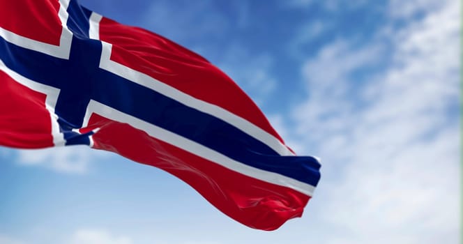 Norway national flag waving in the wind on a clear day. Red field with a blue cross with white outline. 3D illustration render. Selective focus. Rippled textile