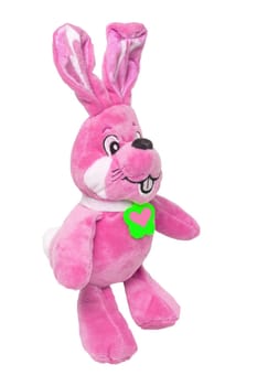 A cute pink plush bunny with heart pendant, isolated on a white background. Easter greeting card decoration item with space for design. Bright plush animal.