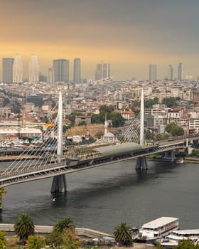 Aerial view of Golden Horn Metro Bridge, or Halic Metro Koprusu, before sunset, Istanbul city, Turkey