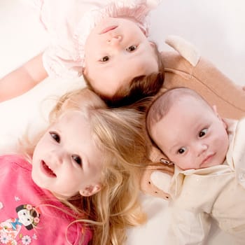little children portraits taken in the studio on a white background