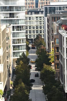 Vertical aerial view of the Am Kaiserkai avenue buildings and vehicles on a sunny day