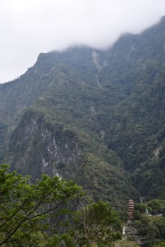 Vertical, beautiful view of hills on a cloudy day in Tianxiang, Xiulin, Hualien, Taiwan