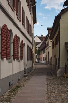 Vertical shot of a narrow street in the old town of Staufen im Breisgau, Germany