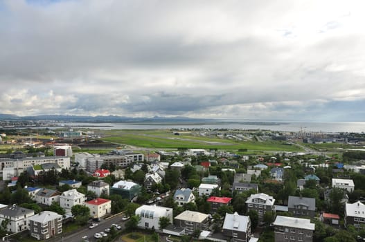 Aerial view of colorful buildings and lush greenery of Reykjavik, Iceland