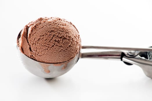 Fresh chocolate ice cream scoop close up.