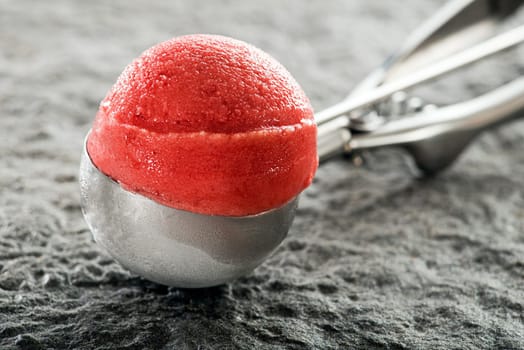 Fresh fruit ice cream sorbet scoop close up.