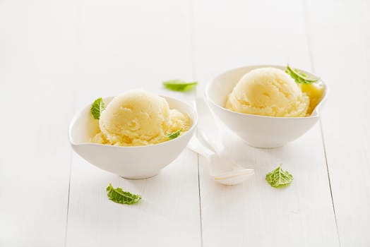 Fresh fruit sorbet ice cream in a white bowl.