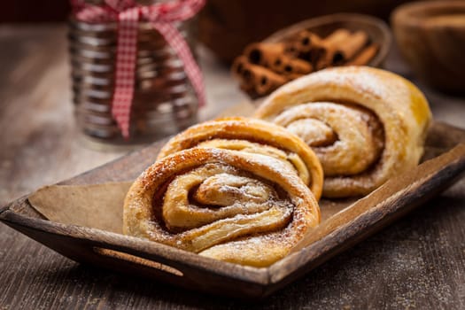 Homemade cinnamon rolls on wooden table