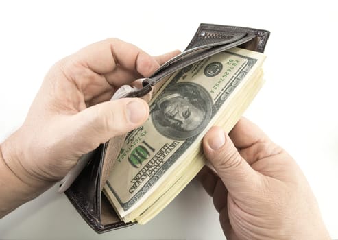 Opening the wallet full of money.