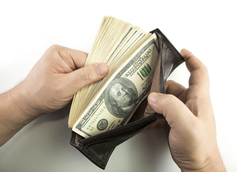 Opening the wallet full of money.