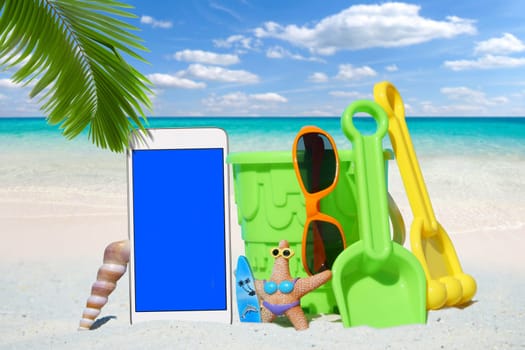 White smartphone,sunglasses and spiezeug on the beach