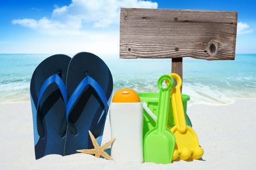 Flip flops,sunmilk,toys and empty wooden sign
