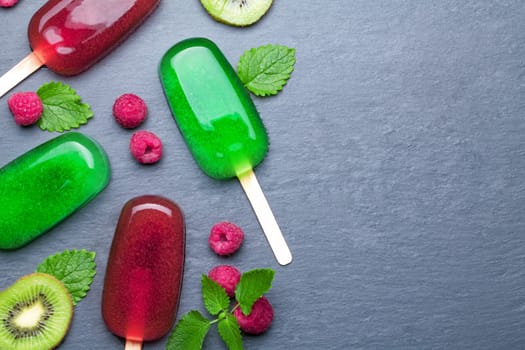 Water ice cream with fruits on chalkboard background