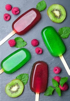 Water ice cream with fruits on chalkboard background