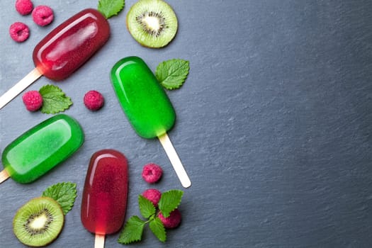 Water ice cream with fruits on chalkboard background