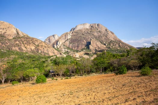 Stunning mountain landscape in the Anja Community Reserve, Madagascar, with vibrant flora and fauna. Nature, travel, adventure, outdoors, hiking, biodiversity. Madagascar wilderness mountain landscape