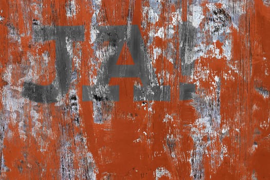 On a weathered red and gray wall is written YES