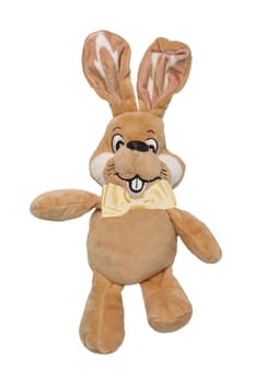 A cute brown plush bunny or rabbit with bow tie isolated on a white background. Easter greeting card decoration element with space for design. Bright plush toy.