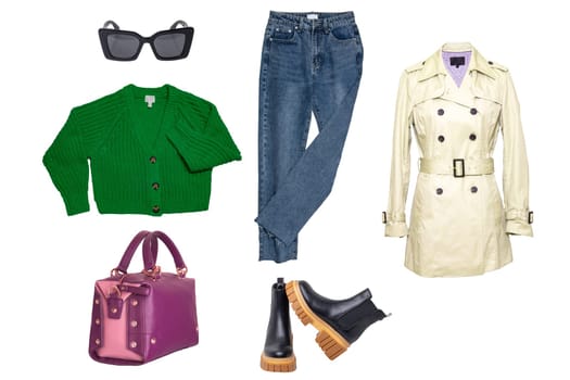 Collage woman clothes. Set of a stylish and trendy women coat, a jeans, chelsea boots, a handbag, a cardigan and other accessories isolated on a white background. Fashion trends.