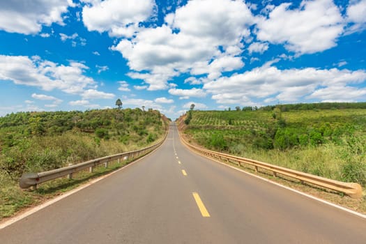 Countryside road and clousy sky. Beautiful rural landscape.