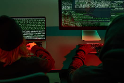 Anonymous people using computer and programming to break code. Cyber security threat. Internet and network security. Access to private information. Anonymous hackers using technology to access to password and encrypted data. Cyber attack