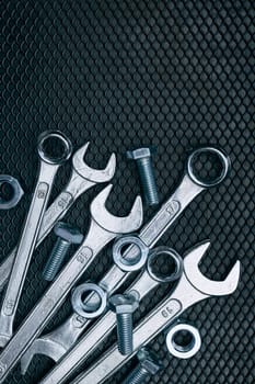 Set of chrome wrenches on steel surface. Mechanic tools for maintenance. Hardware tools to fix. Technical tools background