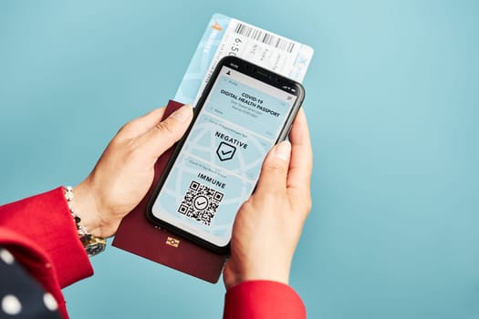 Digital covid certificate. Covid negative rapid digital test pass. Woman passenger holding digital medical pass on her mobile phone, passport and airplane ticket. Traveler showing digital covid test result as medical pass for travel during covid-19 pandemic