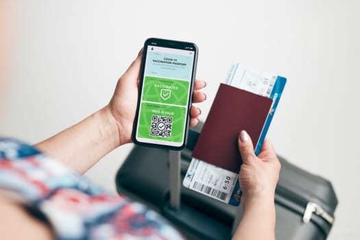 Digital covid certificate. Covid negative rapid digital test pass. Woman passenger holding digital medical pass on her mobile phone, passport and airplane ticket. Traveler showing digital covid test result as medical pass for travel during covid-19 pandemic
