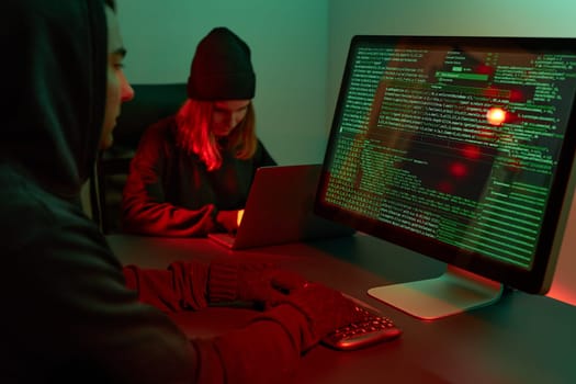 Anonymous people using computer and programming to break code. Cyber security threat. Internet and network security. Access to private information. Anonymous hackers using technology to access to password and encrypted data. Cyber attack