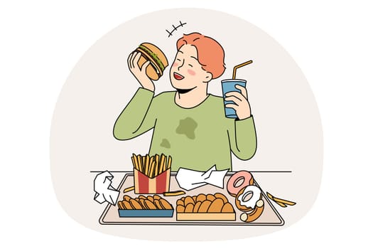 Unhealthy eating in childhood concept. Smiling cheerful fatty boy sitting and eating hamburger donuts french fries drinking lemonade enjoying junk food vector illustration