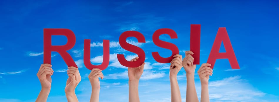 People Or Persons Hands Building English Word Russia. Blue Sky As Background.