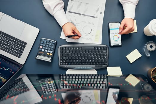 Businessman trading stocks online. Stock investor analysing numbers at graphs and screen. Investor planning and analysing stock market profiit. Man working with stock chart data. Business man investing stock using online platform. Business success concept