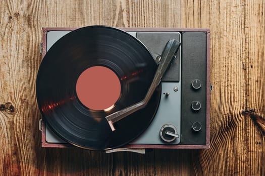 Listening to music from vinyl record. Playing music from analog disk on turntable player. Enjoying music from old collection. Relaxing at home. Retro and vintage. Audio stereo equipment. Analog sound