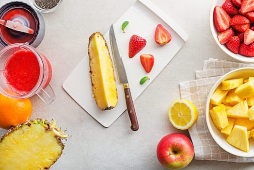 Mixed fresh fruit in blender. Healthy smoothies with fresh summer fruit ingredients