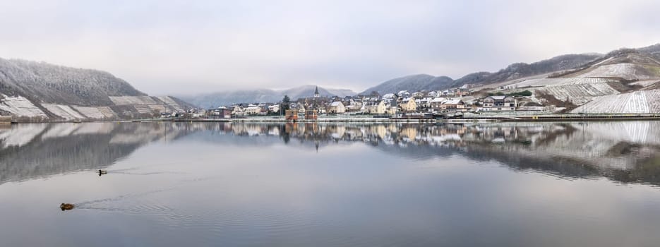 BRUTTIG-FANKEL, GERMANY - DECEMBER 17, 2022: Panoramic image of Bruttig-Fankel on a cold und foggy winter day on December 17, 2022 in Rhineland-Palatinate, Germany