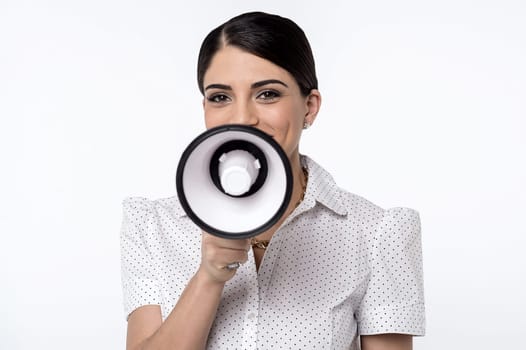 Young woman advertising with loudhailer