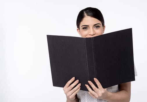 Image of a young female executive with open folder