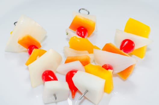 Vitamin-rich skewers with vegetable pieces of onion,yellow peppers and cherry tomatoes.