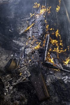 Detail of wood burning with fire and flames, destruction