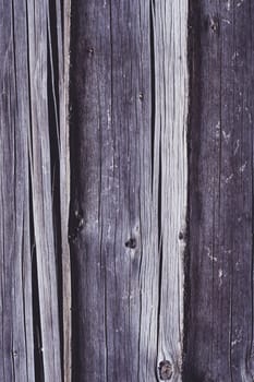 Background texture. Aged brown surface of log house. Copy space. Vertical