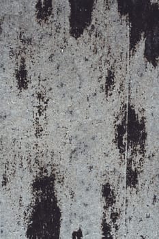 Background texture. Gray old stained surface of roofing material, copy space. Vertical