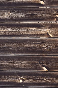Background texture. Aged brown plank surface with nails, copy space. Vertical