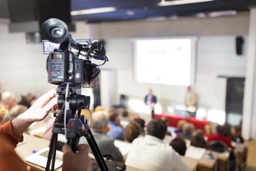Business Conference and Presentation. Audience at the conference hall. Television broadcasted press conference.