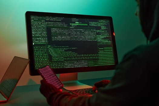Anonymous people using computer and programming to break code. Cyber security threat. Internet and network security. Access to private information. Anonymous hackers using technology to access to password and encrypted data. Cyber attack