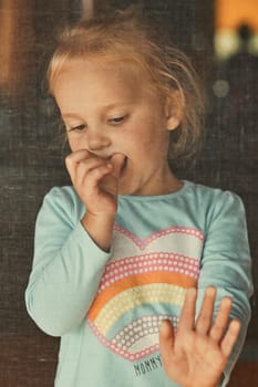 Little adorable girl posing for a portrait. Real people, authentic situations