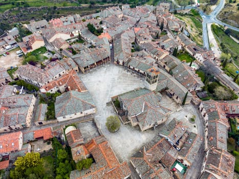 Pedraza medieval walled city in Segovia aerial view of the main square and San Juan Evangelista Church