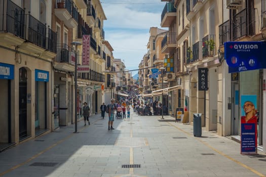 Ronda, Spain, April 2022: View on Carrera Espinel shopping street in Ronda, Andalucia, Spain